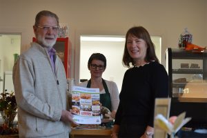 Karen McAra, Polaris Learning with Colin Stirling, Pitscurry Environmental Project with a copy of the recipe book.